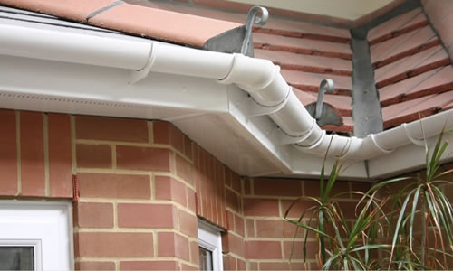 White guttering and fascia around building